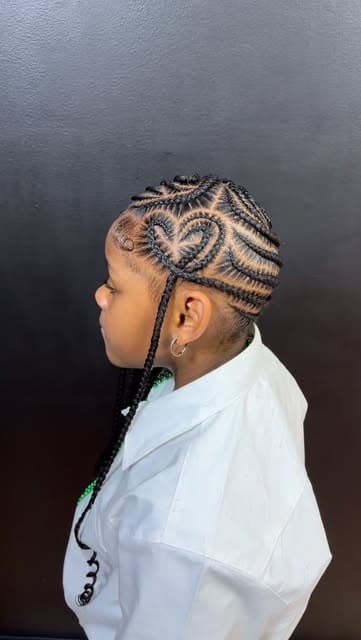 Child's braided style with a heart-shaped pattern detail, side profile