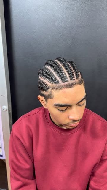 Client with a clean braided pattern, side profile